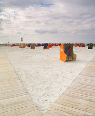 Image showing roofed wicker beach chairs