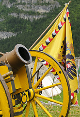 Image showing Yellow cannon and flag
