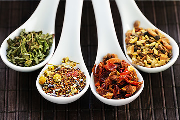 Image showing Assorted herbal wellness dry tea in spoons