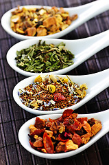 Image showing Assorted herbal wellness dry tea in spoons