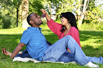 Image showing Happy couple having picnic in park