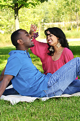 Image showing Happy couple having picnic in park