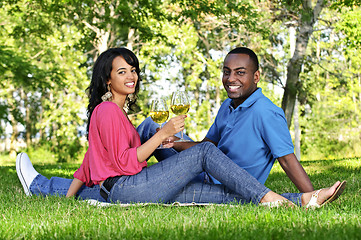 Image showing Happy couple having wine in park