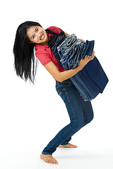 Image showing young woman with her jeans collection