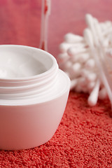 Image showing closeup of facial cream and cotton pads