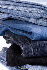 Image showing stack of blue jeans