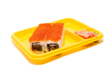 Image showing Yellow plate with rolls of sushi