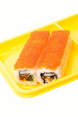 Image showing Yellow plate with rolls of sushi