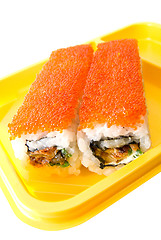 Image showing Rolls of sushi at yellow table 