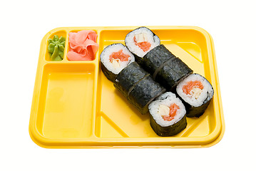 Image showing Yellow plate with rolls of sushi