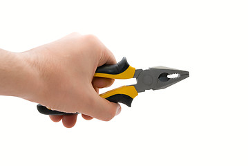 Image showing Male hand with black and yellow pliers
