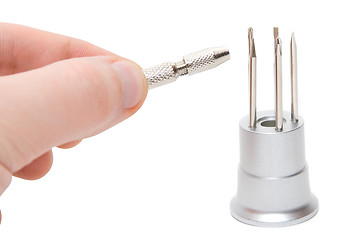 Image showing Hand with metallic screwdriver