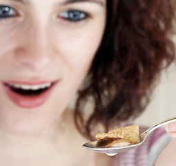 Image showing Young people eating milk with cereals