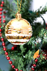 Image showing Christmas ornaments on tree.