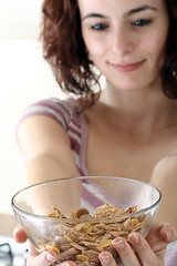 Image showing Young people eating milk with cereals