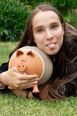 Image showing Girl with Piggy