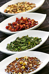 Image showing Assorted herbal wellness dry tea in bowls