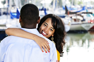 Image showing Happy woman hugging man