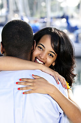 Image showing Happy woman hugging man