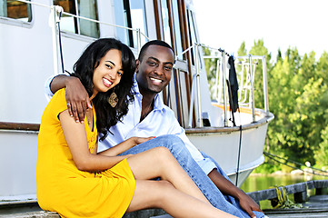Image showing Happy couple in front of yacht