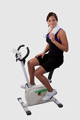 Image showing Girl on exercise bike