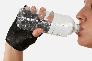 Image showing Drinking from water bottle