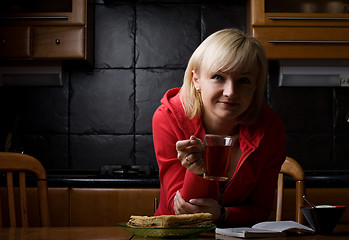 Image showing girl with a book in a cafe