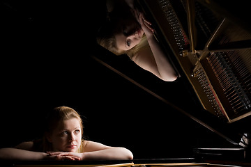 Image showing Girl after a grand piano