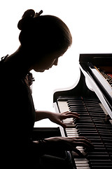 Image showing girl playing the piano