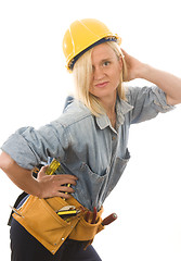 Image showing attractive woman contractor with tools and hard hat helmet