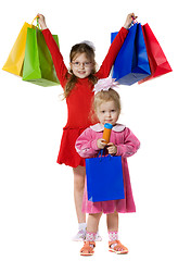 Image showing Little girls with purchases