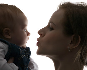 Image showing mum kisses toddler