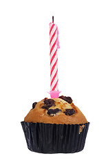 Image showing Raisin muffin with candle