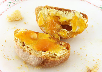 Image showing Bread with butter and honey or marmalade