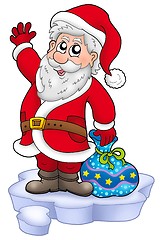 Image showing Cute Santa Claus with gifts on snow