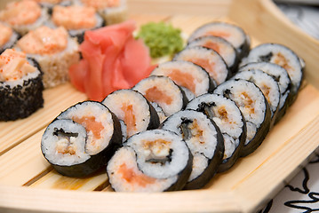 Image showing Sushi on wood plate