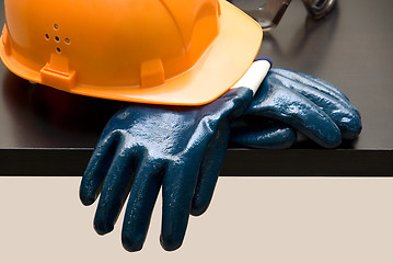 Image showing Orange hardhat and  leather gloves 