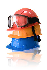 Image showing Many colored hardhats and goggles