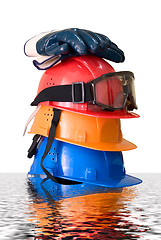 Image showing Many colored hardhats, gloves and goggles