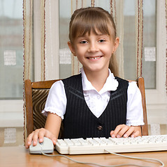 Image showing The girl and the keyboard