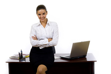 Image showing businesswoman  against office desk