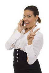 Image showing woman with victory gesture and mobile phone