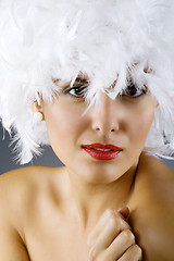 Image showing attractive woman wearing a white feather wig