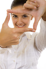 Image showing A woman looking threw her fingers