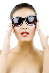 Image showing woman holding her sunglasses