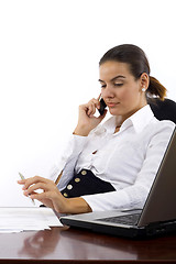 Image showing Young woman calls on cellphone