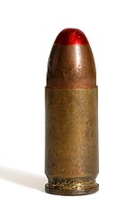 Image showing Single standing red-tipped tracer 9mm Parabellum cartridge isolated