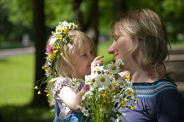 Image showing daughter plays with mum