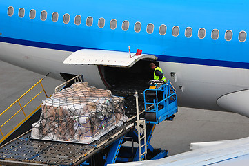 Image showing Airplane loading cargo