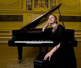 Image showing Dreamy smiling pianist